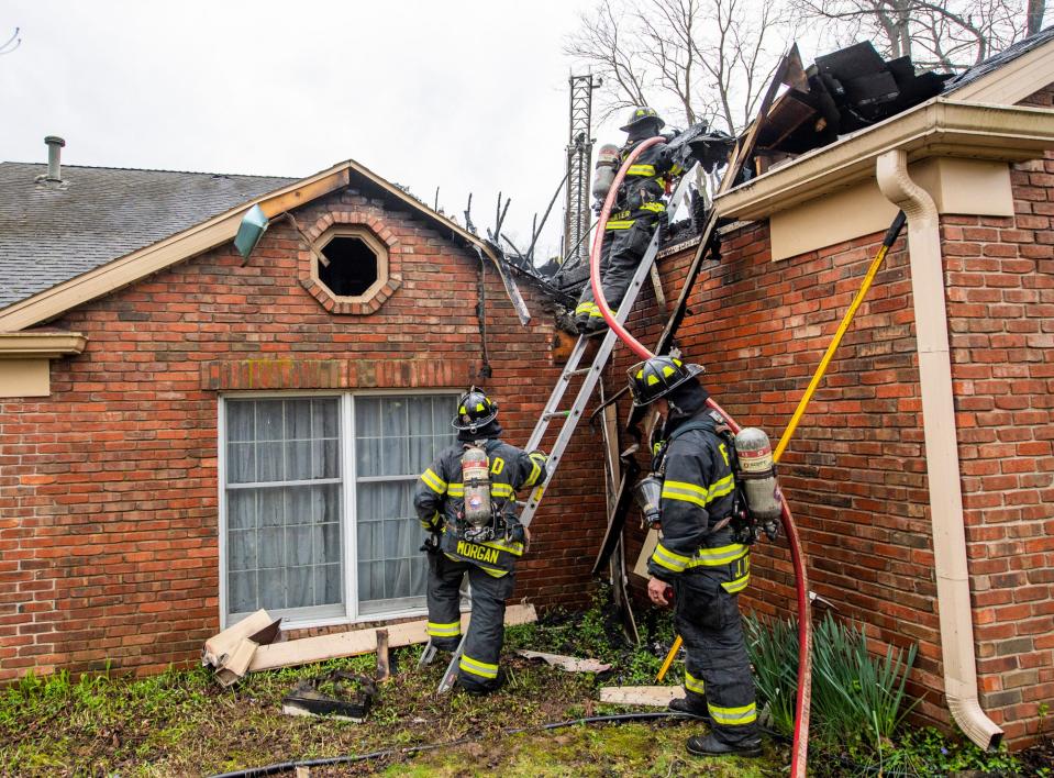 Bloomington Fire Department firefighters check for hot spots at 2610 E. Windermere Woods Drive on Wednesday, April 5, 2023. Lightning is believed to have cause a fire.