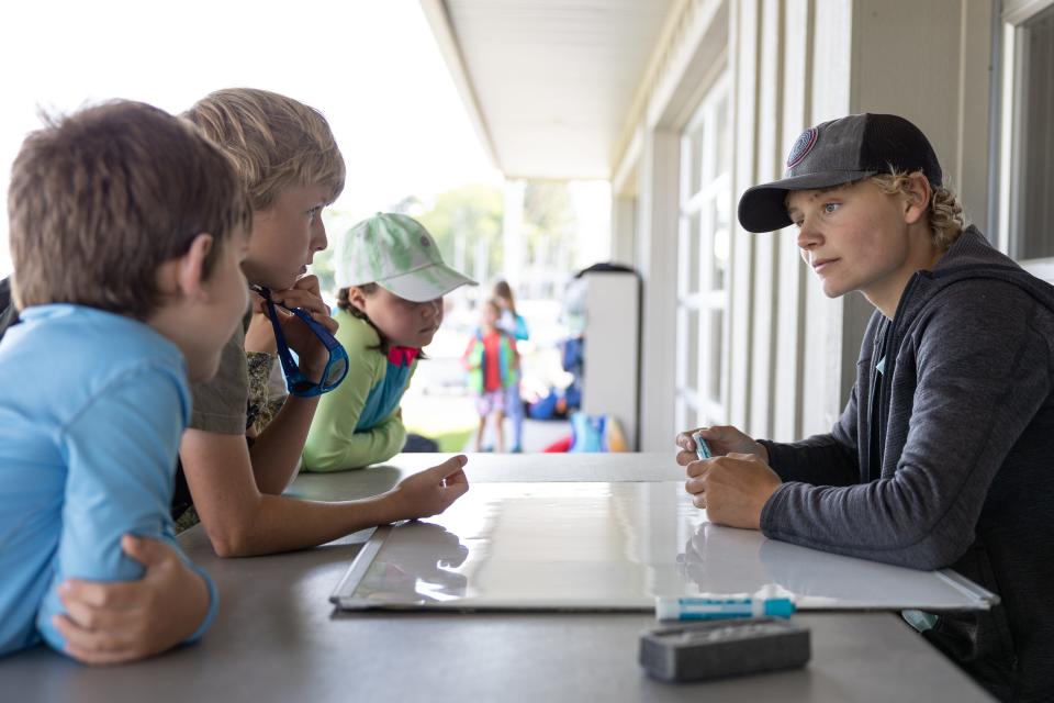 Matthew Tevelde, a first year coach at MBJA Sailing School, briefs students of the day's schedule as they prepare to sail Lake Macatawa on June 12, 2024.