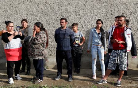 Roma people gather on the outskirts of the town to commemorate the killings of Roma people by right-wing militants in 2009, in Torokszentmiklos, Hungary, May 21, 2019. REUTERS/Bernadett Szabo