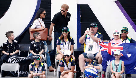 Prince Harry arrives with Meghan Markle. REUTERS/Mark Blinch