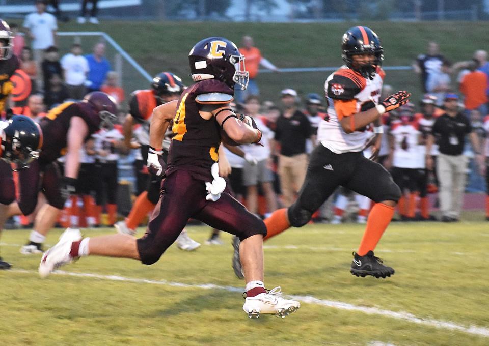 Case #34 Nathan Wood runs the ball at the season opening football game at Joseph Case High School in Swansea Friday, Sept. 9, 2023.