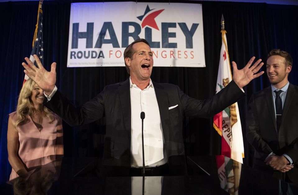 FILE - In this Nov. 6, 2018 file photo, Harley Rouda, Democratic congressional candidate in the 48th district, addresses his supporters at his election night party in Newport Beach, Calif. Voters will decide whether to reward or punish incumbents for their choices. And while Republicans and Democrats acknowledge that other issues like the economy and health care costs could overwhelm impeachment by next November, both sides, but especially the GOP , are already using the bitter impeachment fight as weapons. (AP Photo/Kyusung Gong, File)