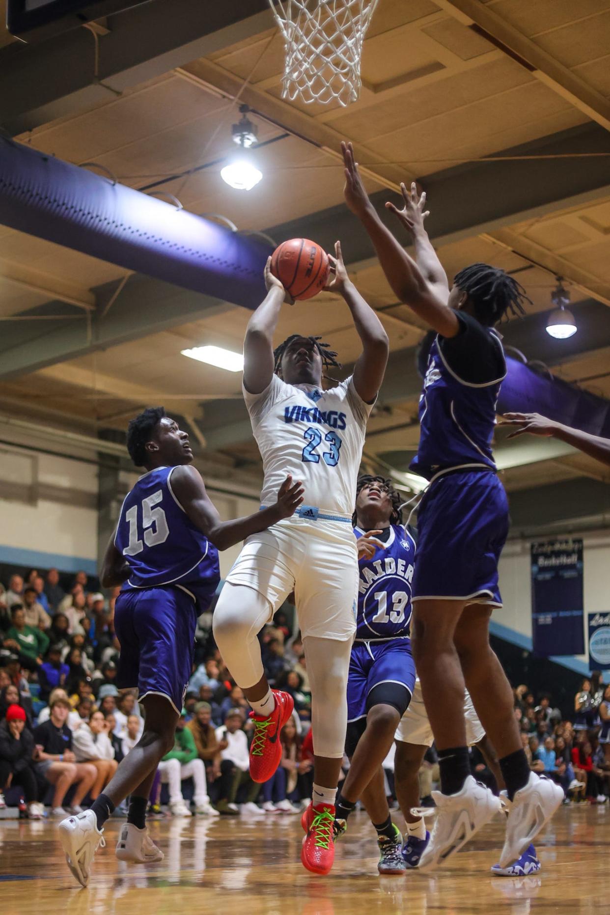 Airline forward Jaden Davis (23) driving to the rim through Huntington defenders at the “Doc” Edwards Basketball Invitational Championship on Saturday, December 30, 2023, in Benton, La.