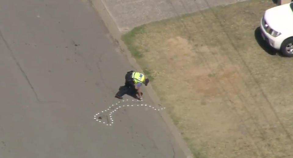 Police marking the road