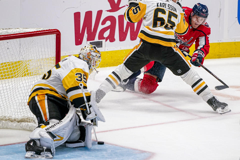 Pittsburgh Penguins goaltender Tristan Jarry (35) blocks a shot by Washington Capitals left wing Beck Malenstyn (47) during the third period of an NHL hockey game Friday, Oct. 13, 2023, in Washington. The Penguins won 4-0. (AP Photo/Andrew Harnik)