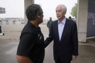 Roger Penske talks with Juan Pablo Montoya, of Colombia, before practice for the Indianapolis 500 auto race at Indianapolis Motor Speedway, Thursday, May 19, 2022, in Indianapolis. (AP Photo/Darron Cummings)