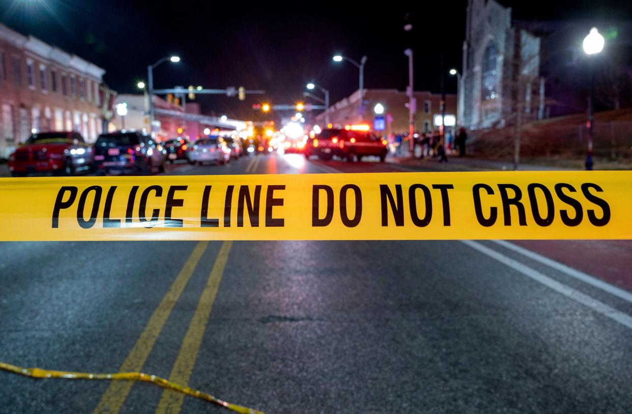Police tape cordons off the area of a mass shooting incident in the Southern District of Baltimore, Maryland (AP)