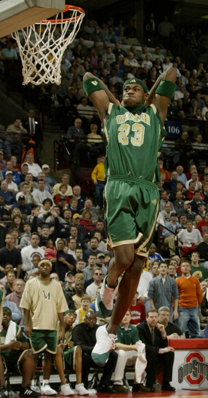 St. Vincent-St. Mary star LeBron James dunks in the Division II championship game against St. Bernard Roger Bacon at Value City Arena on March 23, 2002. James scored 32 points in the losing effort.