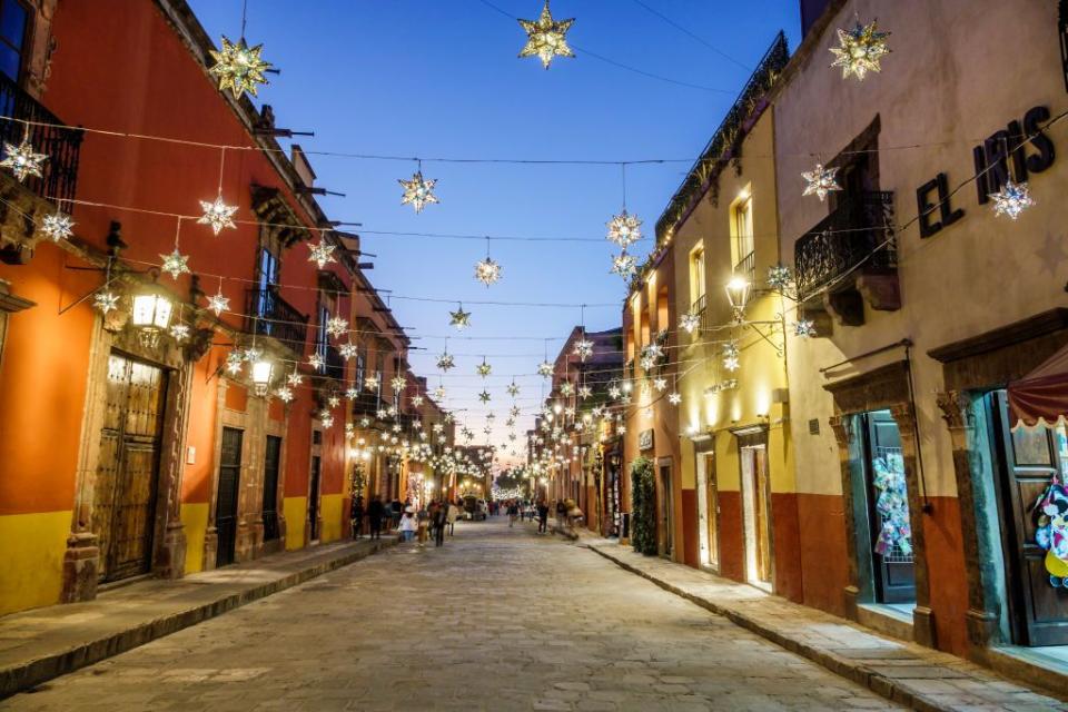 san miguel de allende, guanajuato, mexico, historic district, hanging star christmas decorations, dusk