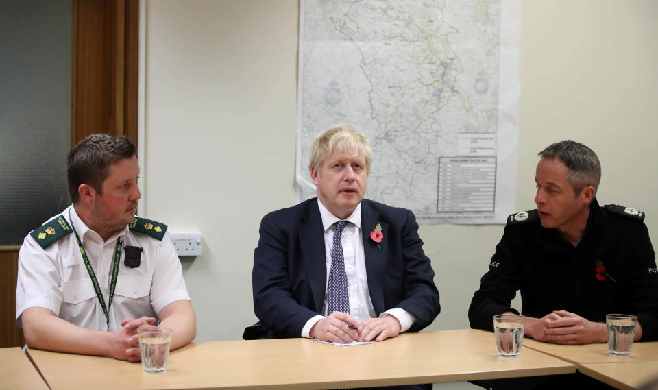 MATLOCK, ENGLAND - NOVEMBER 08: Prime Minister Boris Johnson receives a briefing from emergency personnel at Matlock Police Station on November 8, 2019 in Matlock, England. Parts of northern England endured a month's worth of rain in 24 hours, causing severe flooding (Photo by Danny Lawson - WPA Pool/Getty Images)