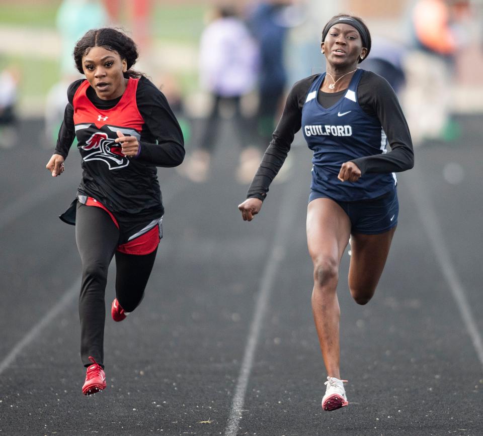 Auburn'S Essence Horton-Graves and Guilford's Jolena Sites run in the 100 meter on Thursday, May 5, 2022, at Belvidere North in Belvidere.