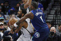 Minnesota Timberwolves forward Anthony Edwards (1) fouls Brooklyn Nets guard Kyrie Irving in the first quarter of an NBA basketball game, Sunday, Jan. 23, 2022, in Minneapolis. (AP Photo/Bruce Kluckhohn)