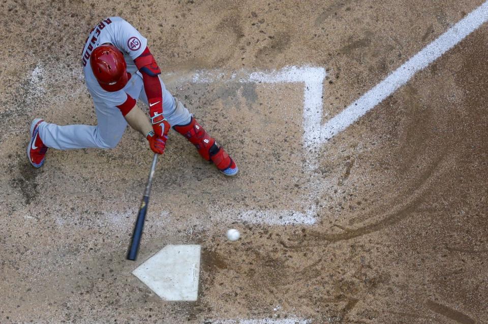 St. Louis Cardinals' Nolan Arenado hits a single during the eighth inning of a baseball game against the Milwaukee Brewers Thursday, May 13, 2021, in Milwaukee. (AP Photo/Morry Gash)