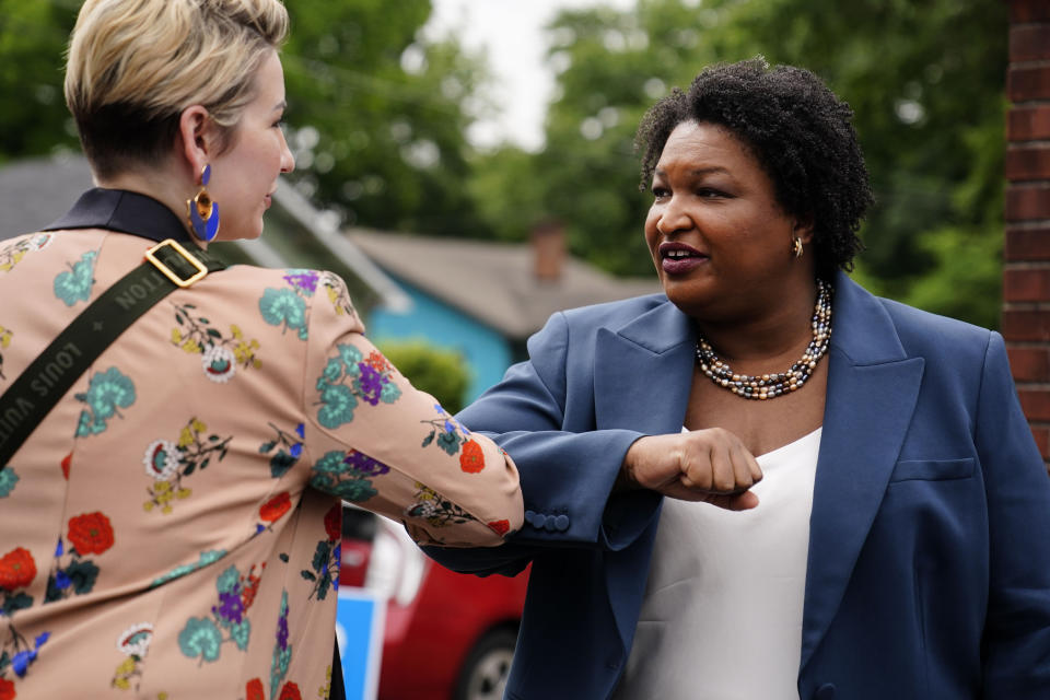 FILE - Georgia Democratic gubernatorial candidate Stacey Abrams greets a supporter May 24, 2022, in Atlanta. Georgia Gov. Abrams is launching an intensive effort to get out the vote by urging potential supporters to cast in-person ballots the first week of early voting as she tries to navigate the state’s new election laws. (AP Photo/Brynn Anderson, File)