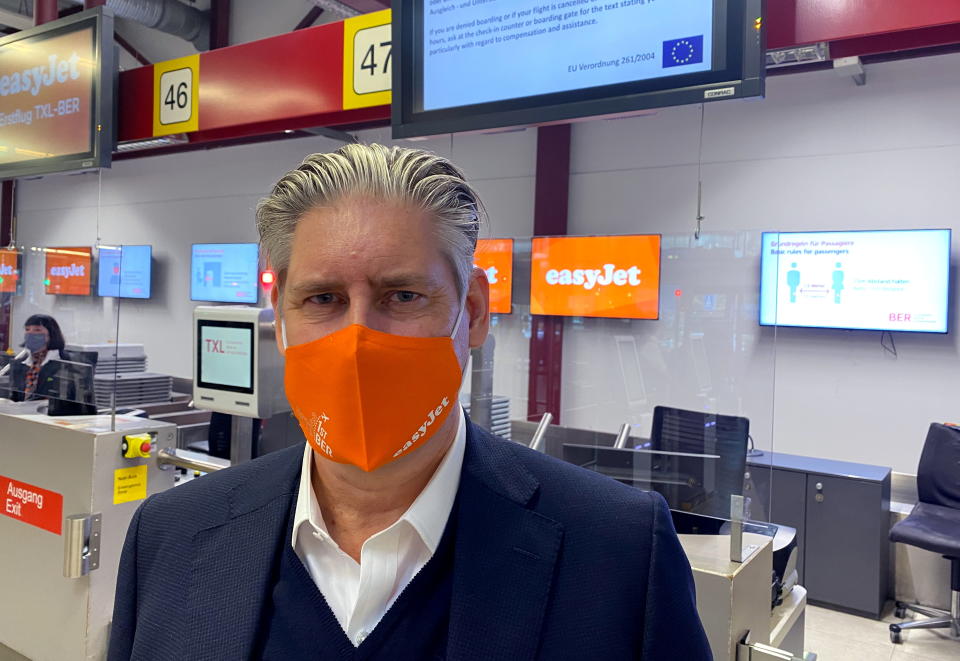 EasyJet CEO Johan Lundgren poses at check in before boarding a flight to new Berlin-Brandenburg Airport (BER) in Schoenefeld, taking off from Berlin Tegel (TXL) airport in Berlin, Germany, October 31, 2020.     REUTERS/Klaus Lauer