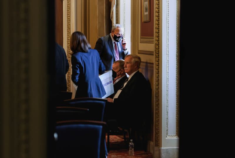 U.S. Senate Majority leader Schumer (D-NY) is seen through a doorway during a Senate Democratic Caucus meeting at the U.S. Capitol in Washingt