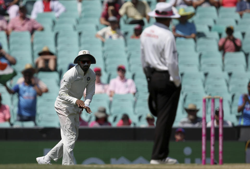 India's K.L. Rahul, left, signals to the umpire that he had not made a catch against Australia on day 3 of their cricket test match in Sydney, Saturday, Jan. 5, 2019. (AP Photo/Rick Rycroft)