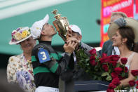 Brian Hernandez Jr. celebrates in the winner's circle after riding Mystik Dan to win the 150th running of the Kentucky Derby horse race at Churchill Downs Saturday, May 4, 2024, in Louisville, Ky. (AP Photo/Jeff Roberson)