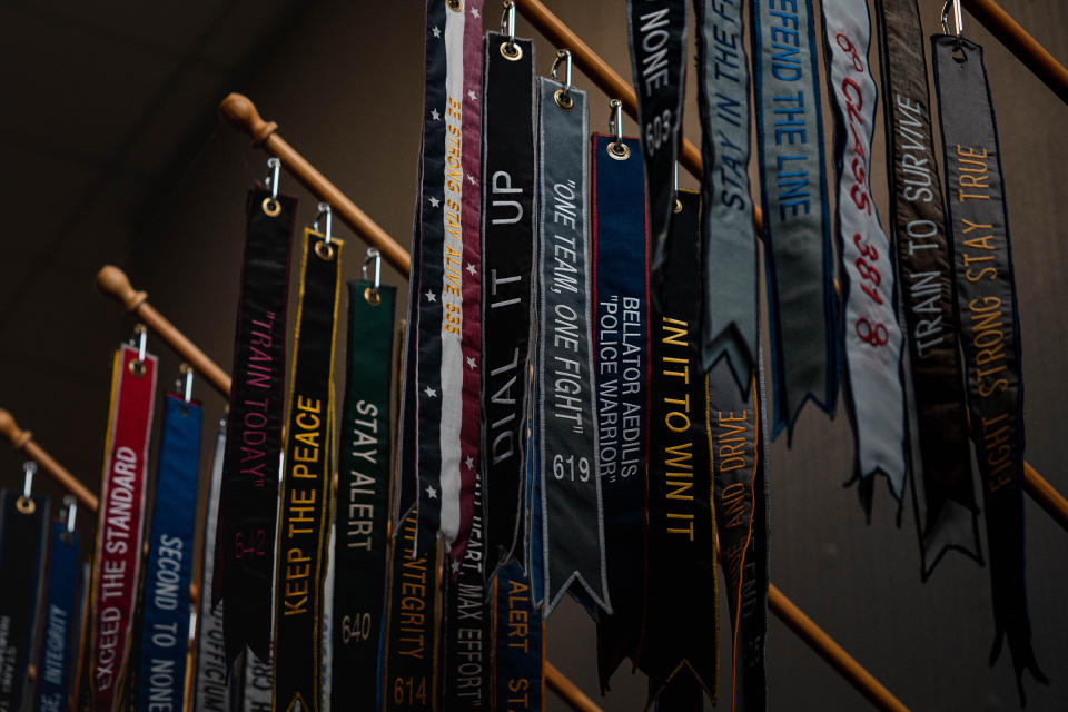 Streamers representing classes of police recruits hang on display. Each streamer shows each class’s number and motto.<span class="copyright">Jovelle Tamayo for TIME</span>