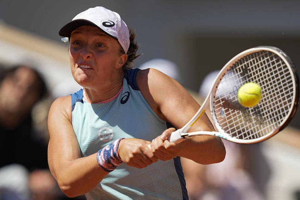 Poland's Iga Swiatek plays a shot against Russia's Daria Kasatkina during their semifinal match at the French Open tennis tournament in Roland Garros stadium in Paris, France, Thursday, June 2, 2022. (AP Photo/Michel Euler)