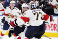 Florida Panthers goaltender Sergei Bobrovsky (72) and defenseman Brandon Montour (62) celebrate after defeating the Toronto Maple Leafs in overtime of Game 5 of an NHL hockey Stanley Cup second-round playoff series Friday, May 12, 2023, in Toronto. (Frank Gunn/The Canadian Press via AP)