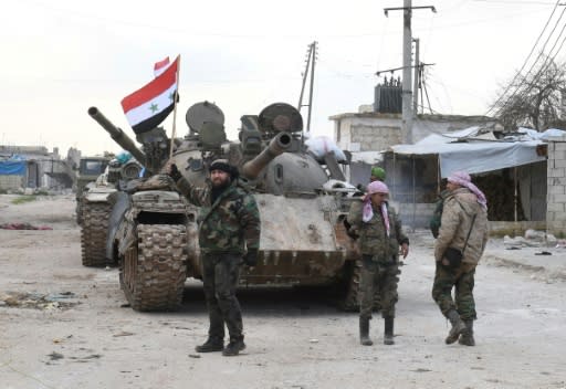 Syrian government forces deploy near the main Damascus-Aleppo highway as they establish full control of the strategic route for the first time since 2012