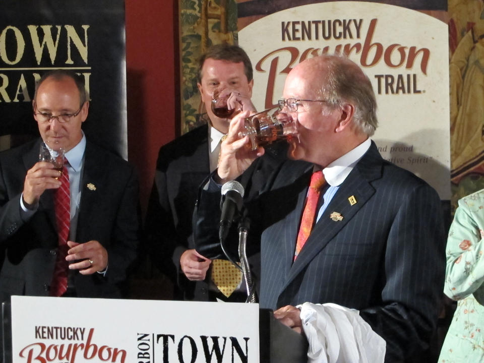 Alltech President Pearse Lyons takes a sip of Town Branch bourbon on Thursday, Aug. 16, 2012, in Lexington, Ky., to celebrate his distillery’s addition to the Kentucky Bourbon Trail. Alltech’s Lexington Brewing & Distilling Co. is becoming the seventh member of the tour that gives visitors a close-up look at how bourbon is produced. (AP Photo/Bruce Schreiner)