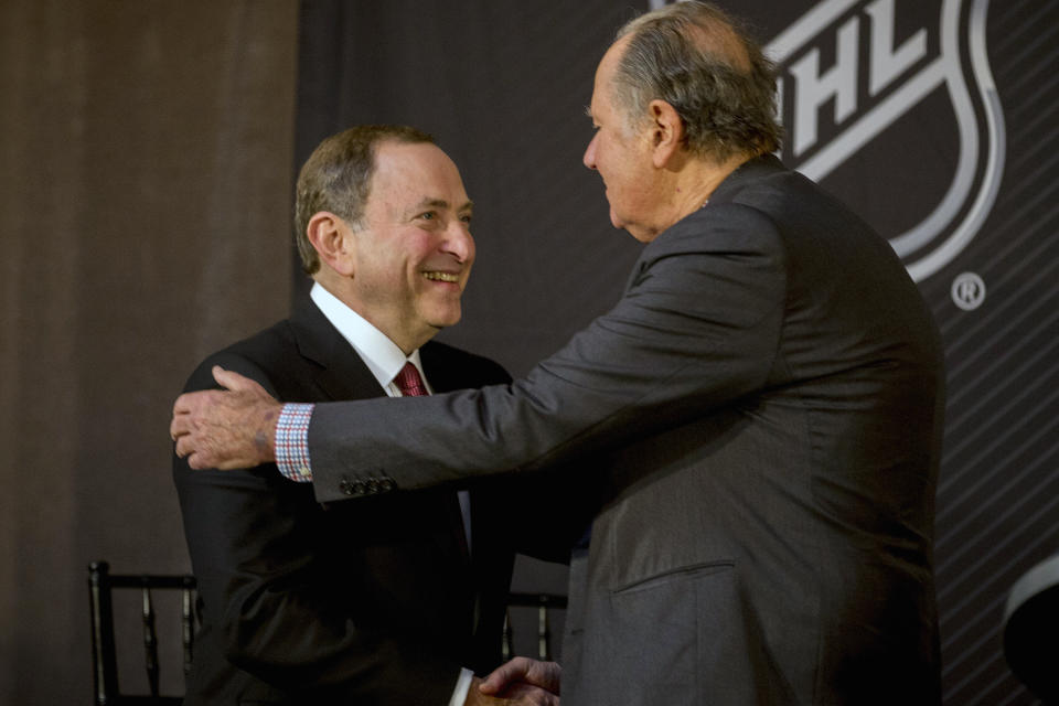 NHL commissioner Gary Bettman, left, shakes hands with Seattle Hockey Partners majority owner David Bonderman after the announcement by the National Hockey League Board of Governors to name Seattle as the home of the league's 32nd franchise, Tuesday, Dec. 4, 2018, in Sea Island, Ga. (AP Photo/Stephen B. Morton)