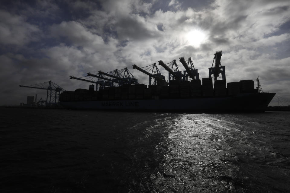 <p>A container ship is silhouetted against the sun as it’s unloaded in the harbor of Rotterdam, Netherlands, Tuesday, Sept. 11, 2018, during a press tour showing the implications of Brexit on the delivery of goods and supply chain. (AP Photo/Peter Dejong) </p>
