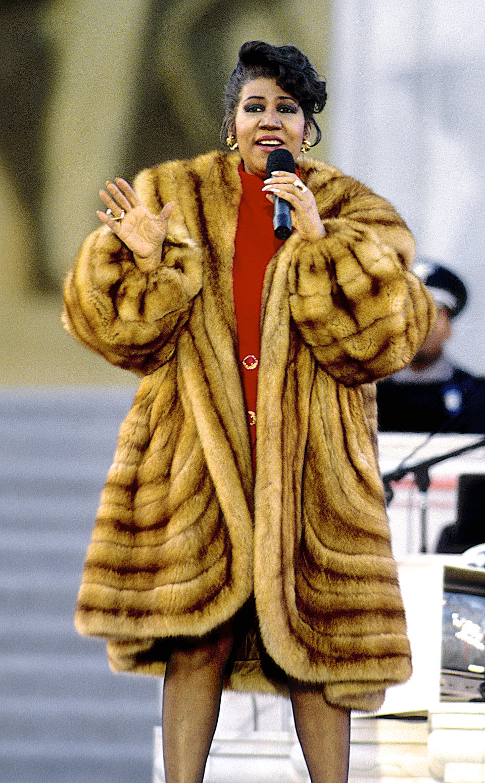 <p>Aretha Franklin wears an oversized brown fur coat over a red mod-style mini dress with gold emerald earrings while preforming at the Lincoln Memorial for President William Jefferson Clinton’s inaugural gala in Washington, D.C. (Photo by Mark Reinstein/Corbis via Getty Images) </p>