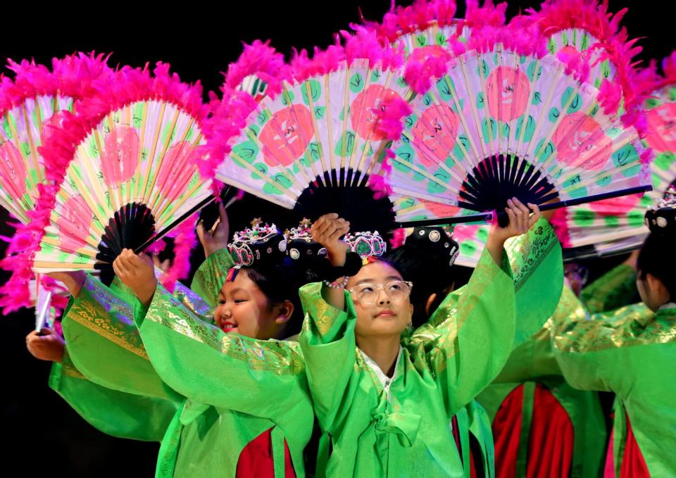 Students from Cahuenga Elementary School perform a Korean fan dance