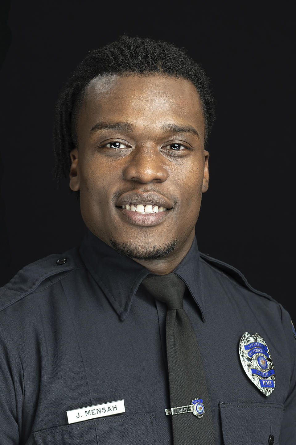 This undated photo provided by the Wauwatosa Police Department in Wauwatosa, Wis., shows Wauwatosa Police Officer Joseph Mensah. In a report released Wednesday Oct. 7, 2020, an independent investigator recommended officials in the Milwaukee suburb fire Mensah, who has shot and killed three people in the last five years. (Gary Monreal/Monreal Photography LLC/Wauwatosa Police Department via AP)