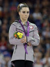 U.S. silver medallist gymnast McKayla Maroney gestures during the podium ceremony for the artistic gymnastics women's vault finals at the 2012 Summer Olympics, Sunday, Aug. 5, 2012, in London. (AP Photo/Julie Jacobson)