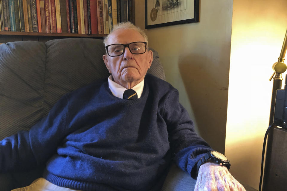 In this Oct. 19, 2018, photo, provided by John W. (Jack) Crawford III, retired Navy Capt. Jack Crawford poses for a photo at his home in Rockville, Maryland. Crawford, who recently turned 100 years old, served on the USS Yorktown during the World War II Battle of Midway and survived the Yorktown's sinking. (John W. (Jack) Crawford III via AP)
