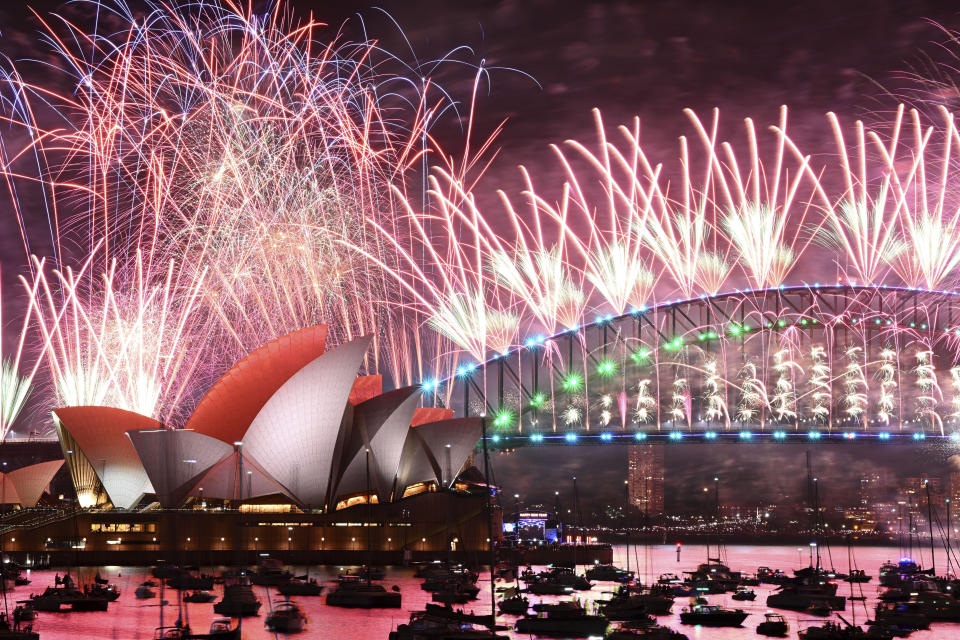 Fireworks explode over the Sydney Opera House and on the Harbour Bridge as part if New Year's Eve celebrations in Sydney, Monday, Jan. 1, 2024. (Dan Himbrechts/AAP Image via AP)