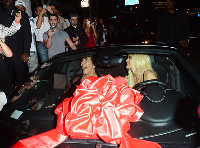 How's this for a birthday gift?! Rapper Tyga, 25, brought out the big guns for his reported girlfriend Kylie Jenner's 18th birthday, gifting the youngest member of the Kardashian clan with a white Ferrari. Kylie's actual birthday is today, though she celebrated in style on Sunday night at Bootsy Bellows nightclub in Hollywood. The luxury car is reportedly a Ferrari 482 Italia, worth $320,000. <strong>WATCH: Kanye West on Tyga and Kylie -- 'I Think He Got in Early, I Think He Was Smart'</strong> All Access Photo Agency Obviously, the birthday girl was pleased with the gift. "So crazy," the reality star said on tape, in awe of her new ride. "This is my dream." All Access Photo Agency Of course, Kylie's mom, Kris Jenner, couldn't resist taking a ride with Kylie, the two posing for pics. All Access Photo Agency The now legal <em>Keeping Up With the Kardashians</em> star went blonde for her big day, surrounded by her famous family. Her sisters Kendall Jenner, Kim Kardashian, Kourtney Kardashian, and Khloe Kardashian were all in attendance at the big bash, as well as Kanye West and Khloe's reported boyfriend, NBA star James Harden. Caitlyn Jenner was also at the festivities, Kylie captioning this group pic, "MY GIRLS. party night. #18@12." Fetty Wap provided the party entertainment, performing his big hit, "Trap Queen." The festivities appeared to be too much for 38-year-old Kanye to handle. Kim posted this picture of the "Only One" rapper all tuckered out by the end of the night. Though nobody's probably happier about Kylie's big day than Tyga. The "Rack City" rapper Instagrammed a racy pic of his reported girlfriend on Monday, writing, "Happy bday to the dopest girl ever!" <strong>WATCH: Khloe Kardashian Hugs It Out With Kylie Jenner and Tyga</strong> Late last month, Khloe defended Kylie and Tyga's reported relationship, telling <em>Complex</em>, "I think at 16 I was probably f**king someone that was in their 20s, for sure. I wouldn't say I was even dating, probably just sleeping with them. But again Kylie is not a normal 17-year-old." "Kylie is taking business meetings and bought her first house, or she's going on a private plane with Karl Lagerfeld to take a meeting," she added. "That's not even what people do in their 30s. It's a rare circumstance, so let's treat this as a special case." Watch below: