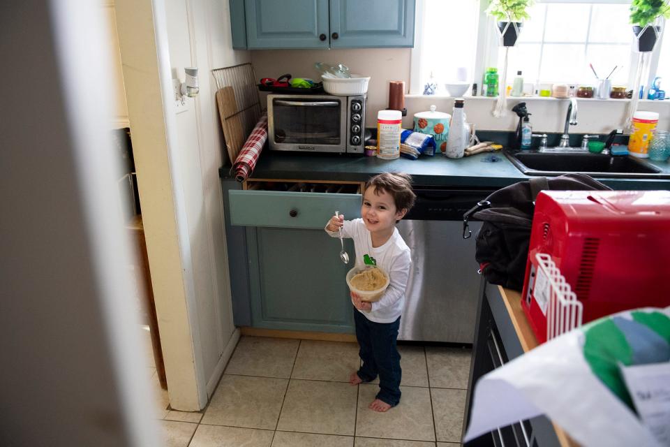 The older Hart boy, 3, plays with a bowl of cookie dough at home in Medford Lakes, NJ.