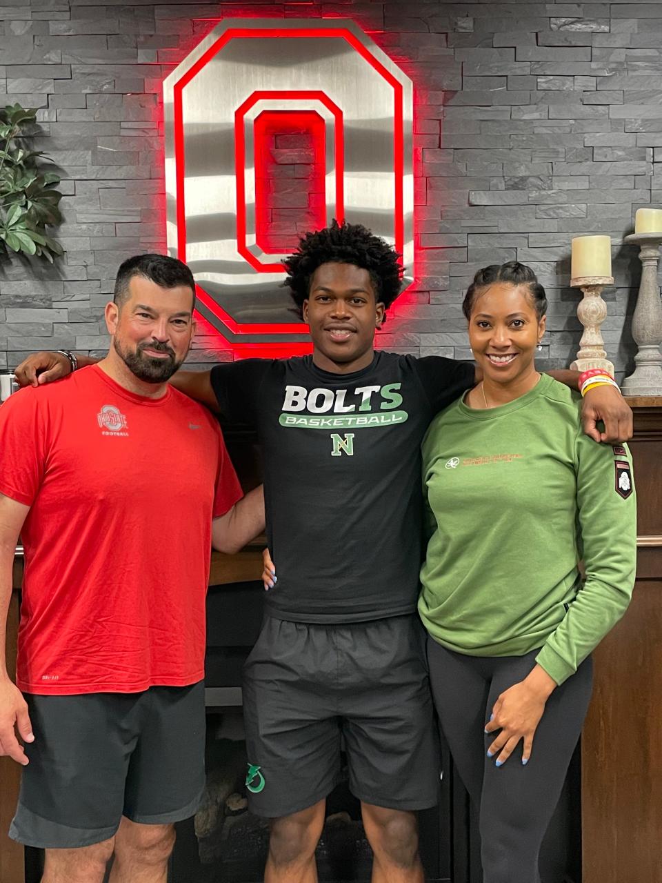 2025 Northmont High School cornerback Dorian Brew poses with his mother Donica Merriman and Ohio State coach Ryan Day on a recruting visit.
