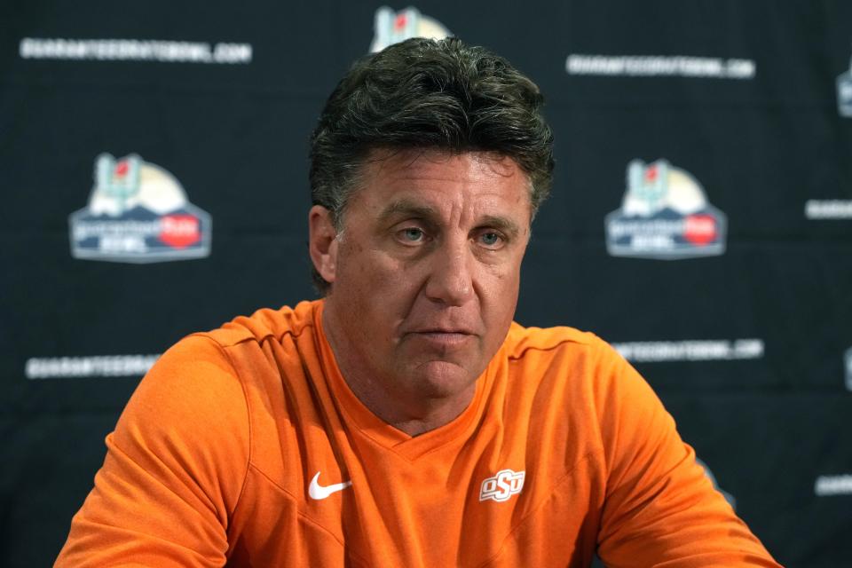 Oklahoma State Cowboys coach Mike Gundy takes questions during Guaranteed Rate Bowl media day.