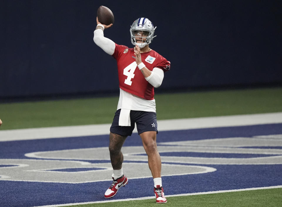 Dallas Cowboys quarterback Dak Prescott (4) passes during an NFL football team practice in Frisco, Texas, Wednesday, May 22, 2024. (AP Photo/LM Otero)