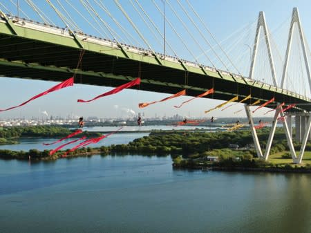 Greenpeace USA climbers form a blockade on the Fred Hartman Bridge near Baytown, Texas