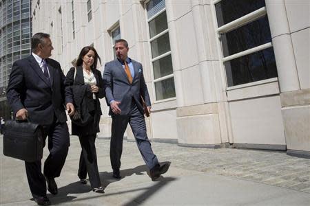 Diana Durand, ex-girlfriend and former fundraiser for Republican U.S. Representative Michael Grimm, exits the Brooklyn Federal Courthouse with her lawyers in the Brooklyn Borough of New York May 5, 2014. REUTERS/Brendan McDermid