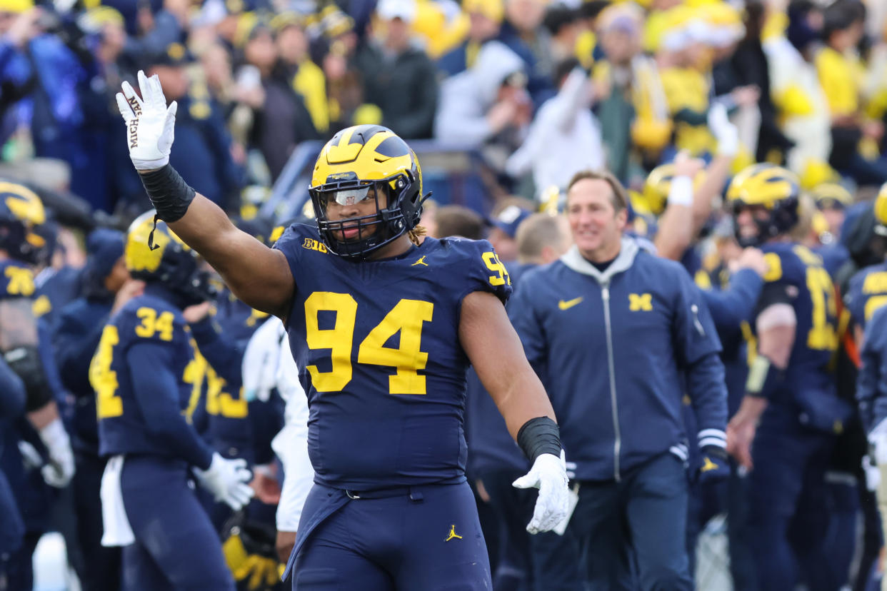 ANN ARBOR, MI - NOVEMBER 25:  Michigan Wolverines defensive lineman Kris Jenkins (94) waves to Ohio State fans as he celebrates in the closing seconds of a regular season Big Ten Conference college football game between the Ohio State Buckeyes and the Michigan Wolverines on November 25, 2023 at Michigan Stadium in Ann Arbor, Michigan. (Photo by Scott W. Grau/Icon Sportswire via Getty Images)