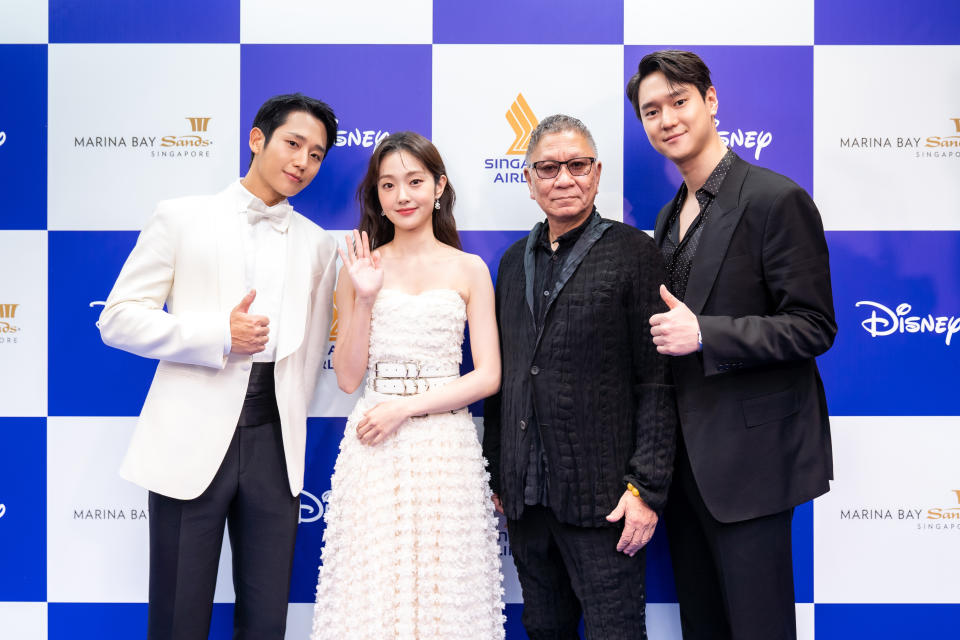 Korean cast of Disney’s APAC Original Connect, Jung Hae-in, Ko Kyung-pyo and Kim Hye-jun with the series’ legendary Japanese director, Miike Takashi on the blue carpet at the Disney Content Showcase in Singapore.