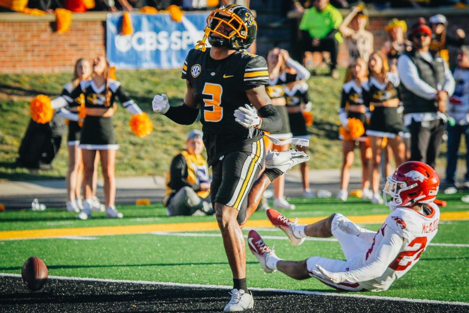 Missouri wide receiver Luther Burden (3) reacts after missing a catch over Arkansas' Quincey McAdoo (24) on Nov. 25, 2022, in Columbia, Mo.