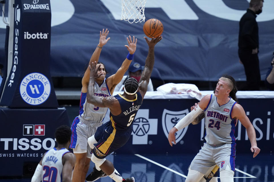 New Orleans Pelicans guard Eric Bledsoe shoots against Detroit Pistons guard Frank Jackson, top left, during the first half of an NBA basketball game in New Orleans, Wednesday, Feb. 24, 2021. (AP Photo/Gerald Herbert)