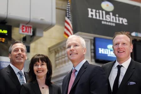 Hillshire Brands CEO Sean Connolly (2nd-R) poses with company executives on the floor of the New York Stock Exchange, July 3, 2012. REUTERS/Brendan McDermid