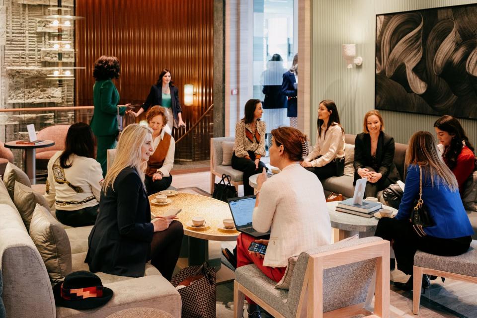 a group of women sitting in a room