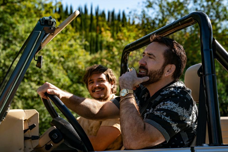 Nick (Nicolas Cage, right) and Javi (Pedro Pascal) enjoy a Spanish bromance in the meta action comedy "The Unbearable Weight of Massive Talent."