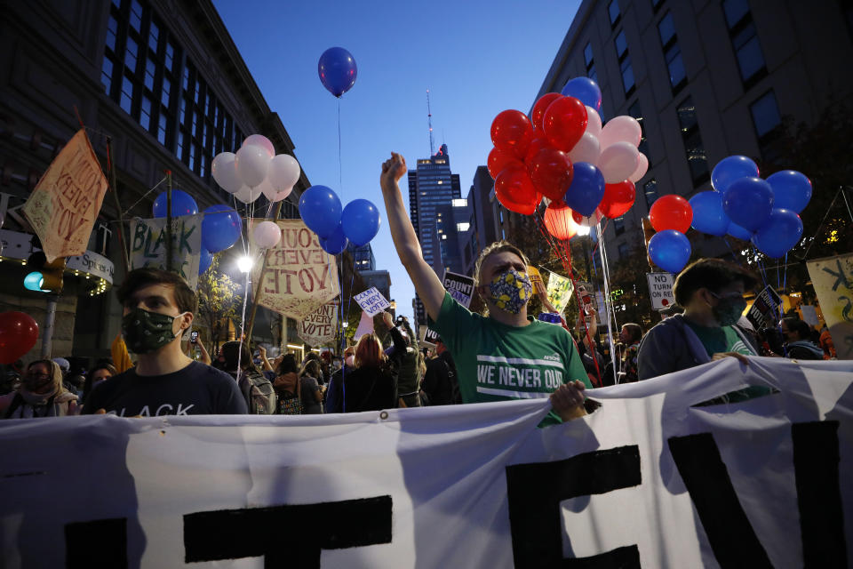 People urging that all votes be counted demonstrate outside the Pennsylvania Convention Center where votes are being counted, Thursday, Nov. 5, 2020, in Philadelphia, following Tuesday's election. (AP Photo/Rebecca Blackwell)